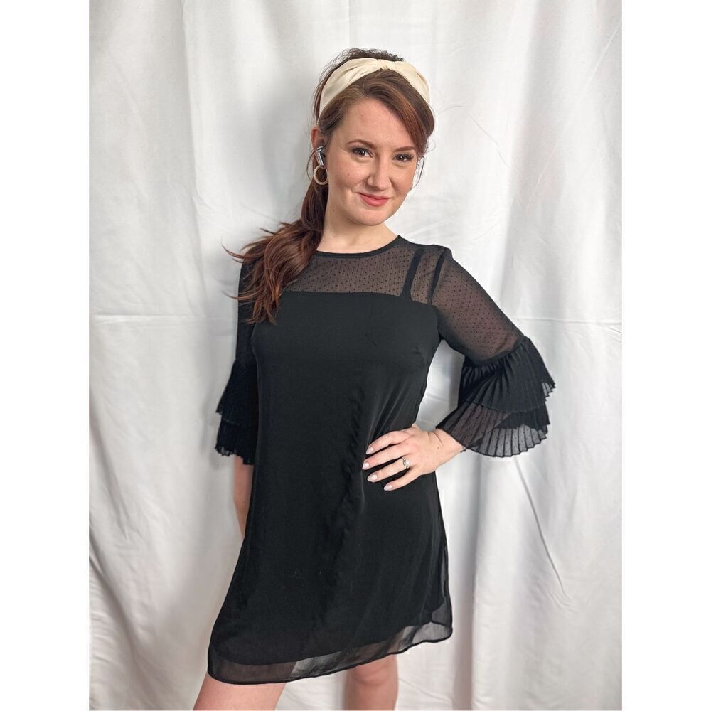 Francesca’s black dress